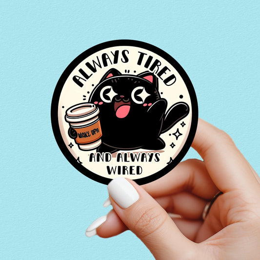 funny mental health sticker. black cat drinking coffee.  text on sticker center and the text “always tired always wired” great gift for water bottle sticker lover and coffee lover.